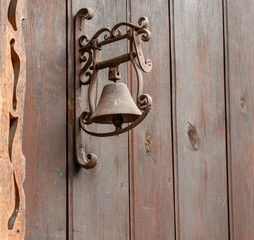 Naklejka premium an old door bell on wooden background