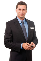 Businessman texting with mobile phone on white