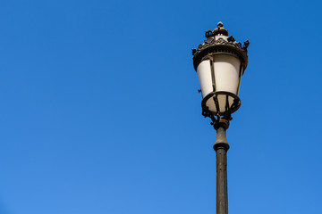 Fototapeta na wymiar Vintage Street Lamp On Blue Sky