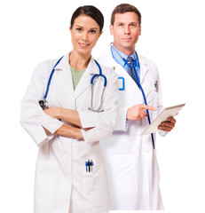 Fototapeta premium Male female doctor nurse practitioner with tablet computer isolated on white background