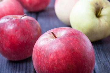 Fototapeta na wymiar ripe red apples on a table selective focus photo