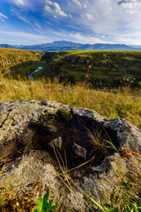 Fototapeta premium Beautiful view of Dzoraget river's gorge and a huge stone, Armenia