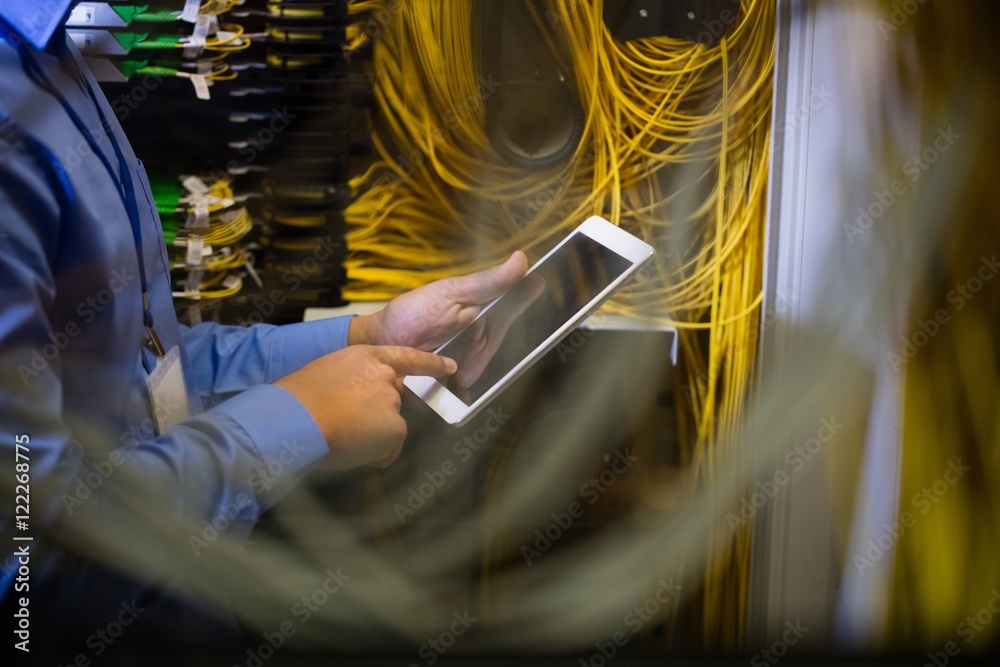 Poster technician using digital tablet