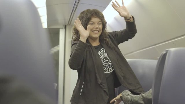 girl dancing in public transport.