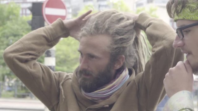 Cheerful Hippie Guy With Long Hair.