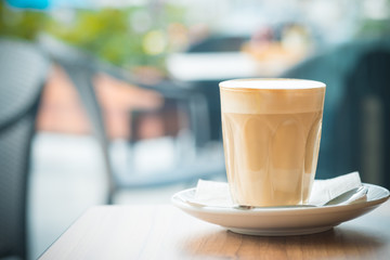 hot coffee latte with stain on the cup, background concept