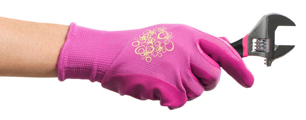 Woman holding adjustable wrench on white