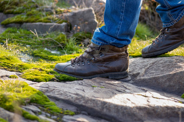 guy in comfortable shoes stepping on stones