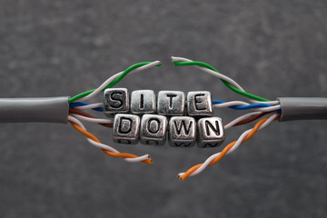 Site down text for website maintenance with grey background © raskjaer