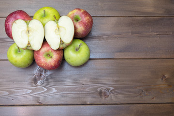 Red fresh apples on the wooden table