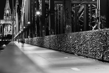 Cologne Cathedral from the Hohenzollern Bridge in Cologne Germany in black and white