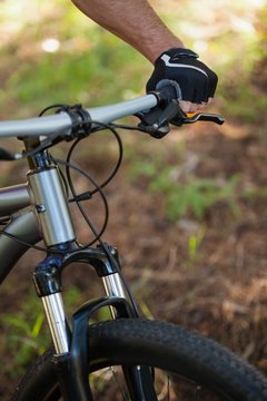 Close-up of male mountain biker riding bicycle