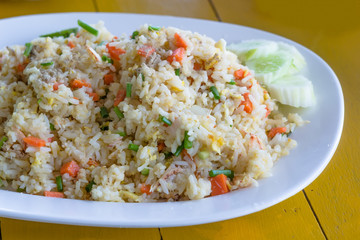 Fried rice with crab on white dish.