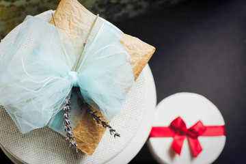 Wrapped Gift Boxes With Blue Bow and Lavender 