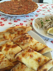 traditional turkish food on table (lahmacun and pide)