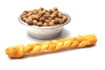 Dog chew toys and a bowl of dog food
