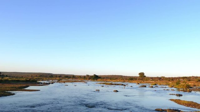 Picturesque olifants river in the Kruger national park with warm late afternoon light