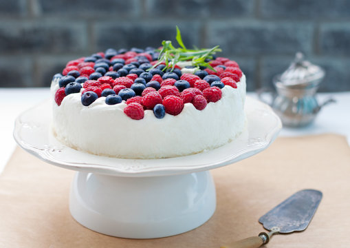 Cheesecake, cream mousse cake with fresh berries Grey stone background. Selective focus