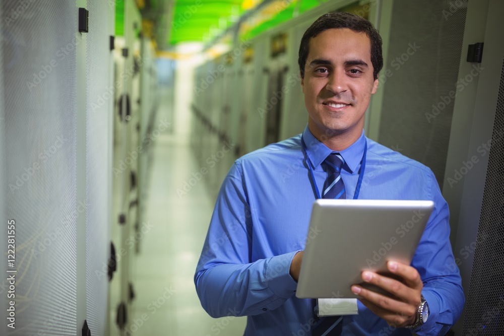 Aufkleber portrait of technician using digital tablet in hallway