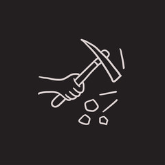 Hand using pickax sketch icon.