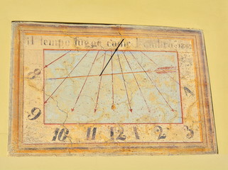 Fototapeta na wymiar The solar clock on the wall