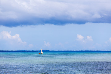 Fisherman boat in the ocean.Tropical seascape, Zanzibar Island, Tanzania