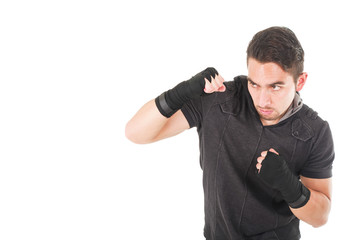 handsome latin fighter wearing black clothes training