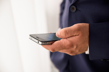 Close-up Of A Person's Hand Holding Mobile Phone