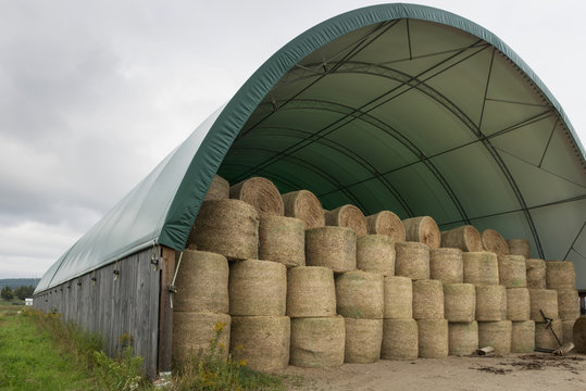 Hale bales stored in a covered structure, Montebello, Quebec, Canada