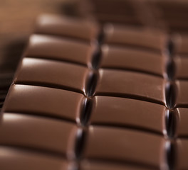 Chocolate bar, candy sweet, dessert food on wooden background