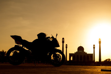 Silhouette of big bike and Mosque