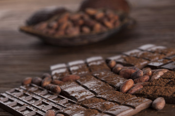 Dark and milk chocolate bar on a wooden table