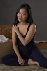 Young Attractive Asian Woman Sitting for Portrait