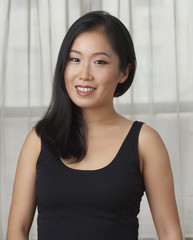 Young Attractive Asian Woman Sitting for Portrait