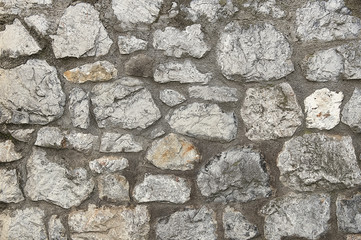 Old grey stone wall background texture