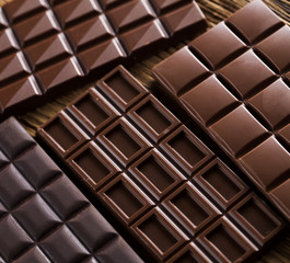 Bars Chocolate , candy sweet, dessert food on wooden background