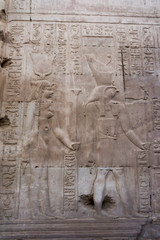 Hieroglyphic carvings on the exterior walls of  egyptian temple