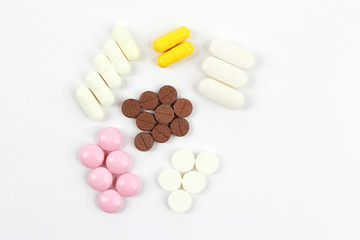 different medicinal pills on white background
