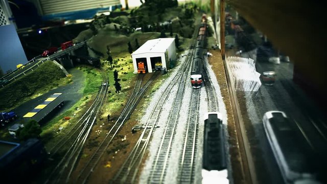A model train comes down the tracks at the county fair.