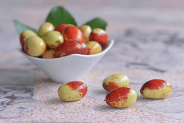 Fresh Chinese jujube on marble background