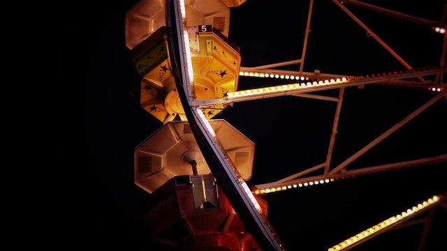 A close up of pods on a ferris wheel.
