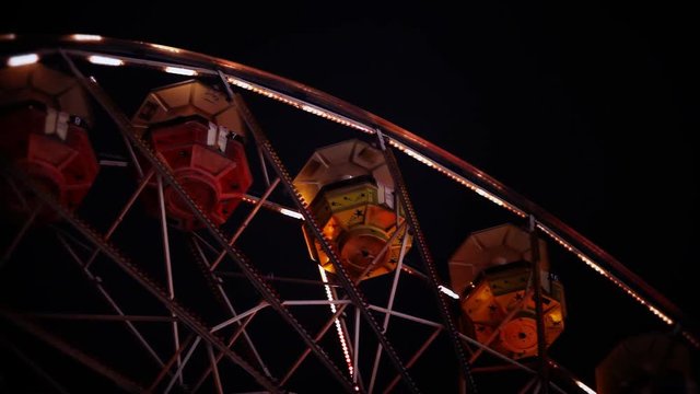 Looking up at the top of the ferris wheel.
