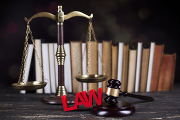 Obraz na płótnie Canvas Law book, mallet of the judge, justice scale, wooden desk backgr