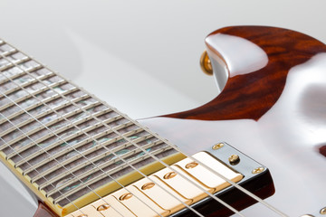 Electric guitar with gold pickups for a left handed player