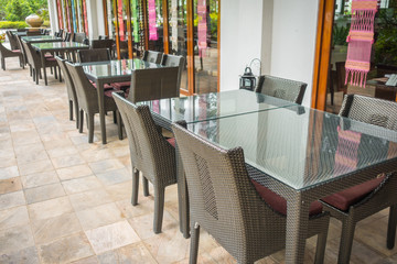 Tables and chairs in restaurant.. .