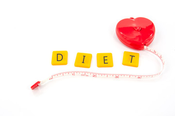 measure tape red heart shape with plastic letter diet isolated on white ,abstract background for diet or lose weight concept.