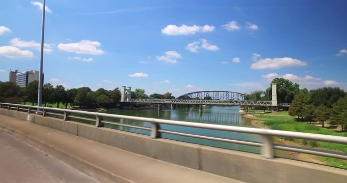 A profile view of various bridges over the Brazos River in downtown Waco, Texas.  	