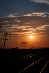 Fototapeta na wymiar Silhouetted Telegraph Lines at Sunrise