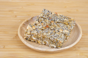 Krayasart placed on a wooden bowl, stir the sugar, coconut candy Thailand,There are various types of sticky sweet peas