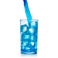 pouring blue water splash into glass isolated on white background with clipping path